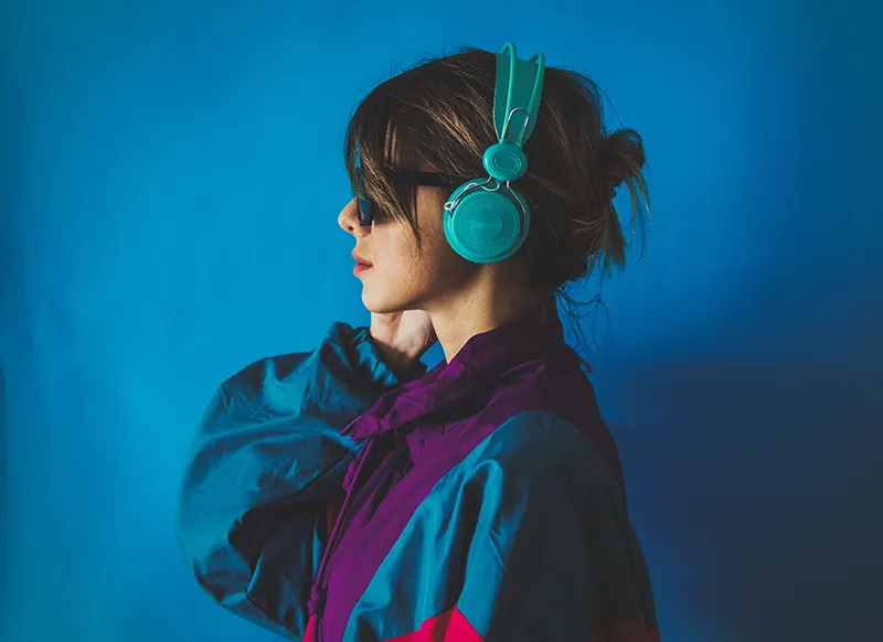 a woman with sunglasses and headphones on